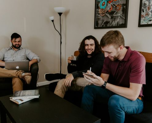 men sitting on sofa